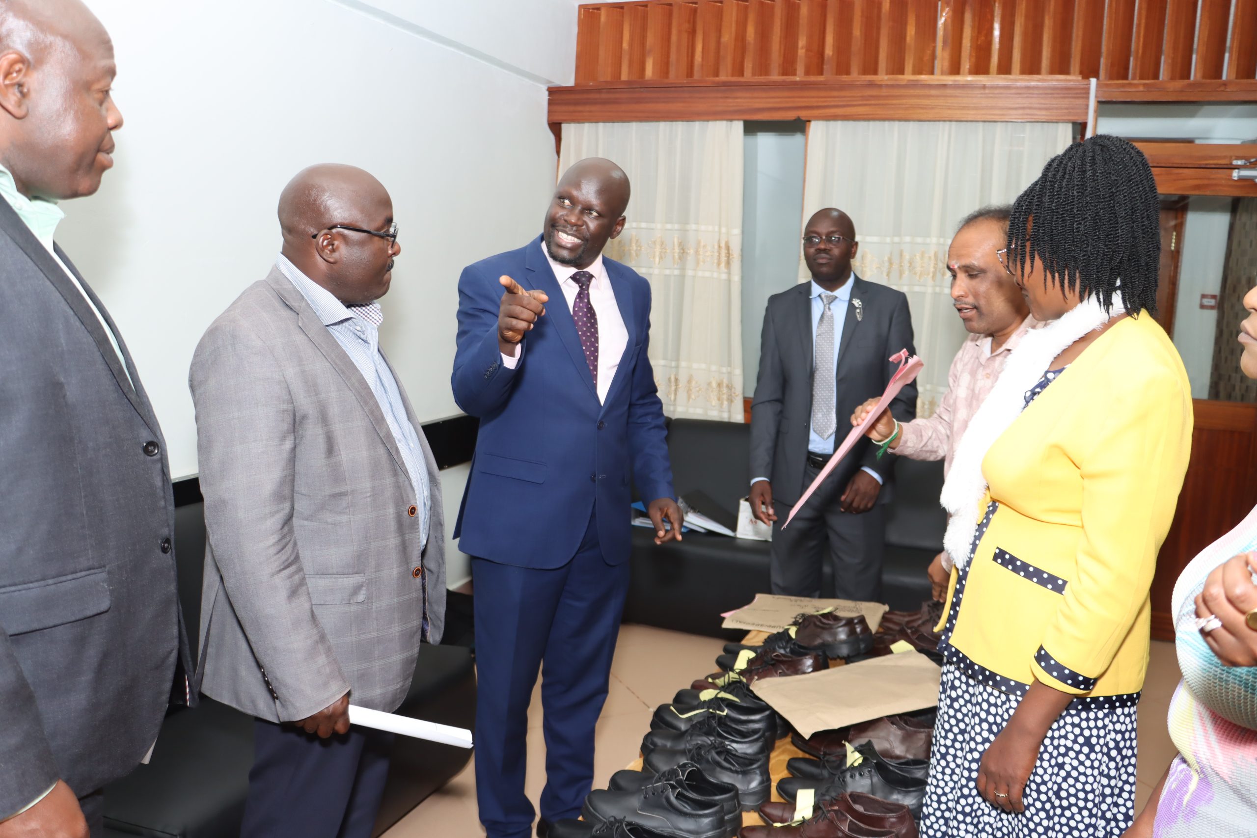 Dr Tanui showcasing high-quality leather products to Dr. Musotsi, Ag Deputy Director, Grants, NRF 
